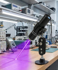 Three Head Purple Laser Level With 2M Charger And 405nm Cross And Linear Laser Generator Rechargeable Alignment Tool on a lab desk