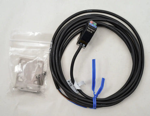 Keyence PZ2-42 Diffuse Reflective Short Range Photoelectric Sensor With Red LED Detects Transparent And Opaque Targets 100 mm Range New In Box Ready To Install Must Have, shown with attached cable and mounting kit.