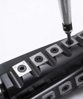 Pro Grade 6 Inch Spiral Helical Cutterhead Replacement Kit For Jet Thickness Planer With Carbide Inserts, Screws, Bits, And Spanner, Easy Drop In Swap For Clean, Precise, Smooth Planing close-up of insert installation.