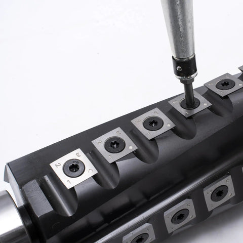 Pro Grade 6 Inch Spiral Helical Cutterhead Replacement Kit For Jet Thickness Planer With Carbide Inserts, Screws, Bits, And Spanner, Easy Drop In Swap For Clean, Precise, Smooth Planing close-up of insert installation.