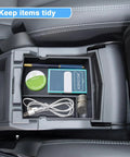 Upgraded Center Console Organizer Tray for Subaru Forester 2019-2024 installed, showing tidy arrangement of small items.