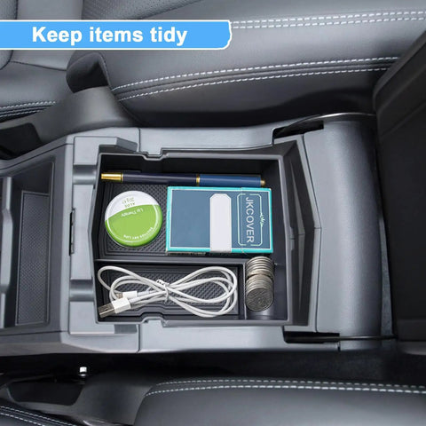 Upgraded Center Console Organizer Tray for Subaru Forester 2019-2024 installed, showing tidy arrangement of small items.