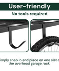 Close-up of Beefy Heavy Duty Overhead Garage Ceiling Storage Hooks Four Pack Add On Rail Hook Accessory holding bike wheel.