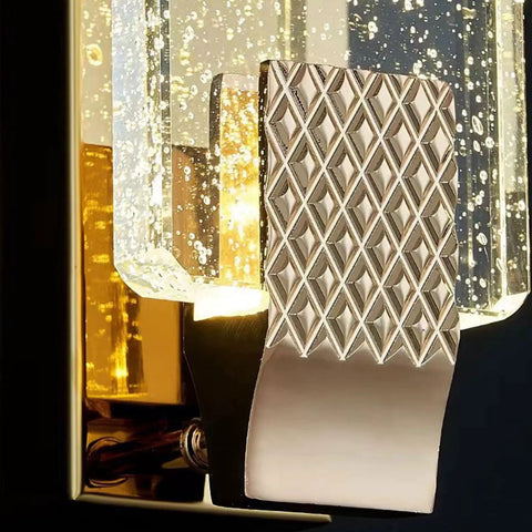 Slick Modern Crystal Wall Sconce Lights For Cozy Bedroom And Living Room Vibes With Up Down Led Wall Lamp Fixtures In A Solid 2 Pack For Indoor Outdoor Bathroom Decor; close-up of textured base and clear crystal shade.
