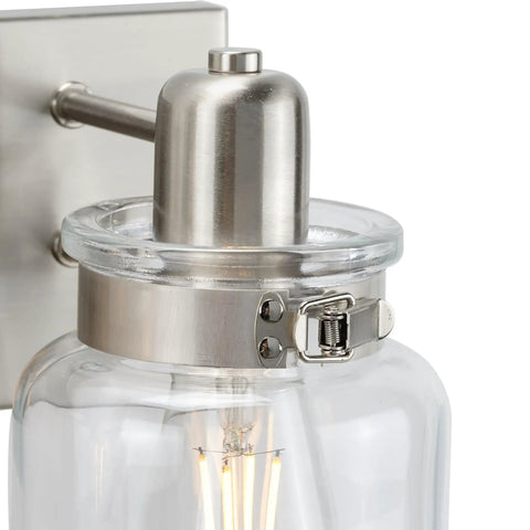 Close-up of Calhoun Collection Clear Glass Farmhouse Bath Vanity Light Three Light Brushed Nickel Vintage Inspired Fixture