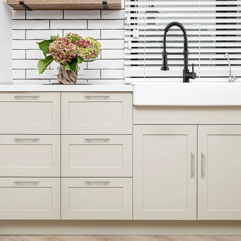 Modern kitchen with 30 Pack Brushed Nickel Cabinet Pulls 7-3/8 Inch Long Stainless Steel Handles on cream drawers and cabinets.