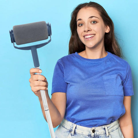 A person holding the Straight-Up High Performance Paint Roller Kit with Telescoping Pole for easy use on walls and ceilings.