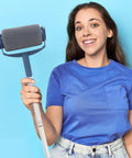 Heavy Duty Telescopic Paint Roller Kit With Extending Handle And Internal Reservoir for walls and ceilings held by a person.