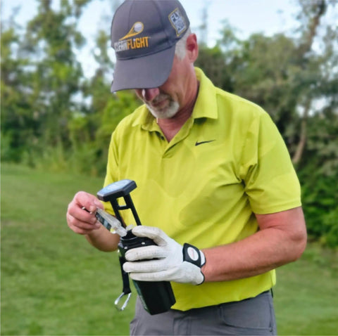 Golfer using Premium Golf Ball Washer With Variable Hex Brush System Portable Ball Cleaner For Golf Bag Or Cart North American Made
