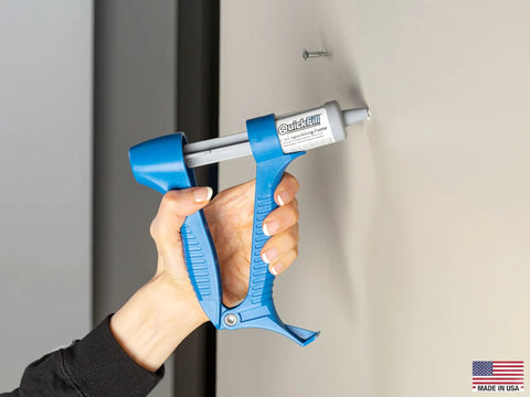 Using Drywall Repair Kit With Built In Spatula Tool And Two 20ml Spackling Paste Cartridges To Fill Nail Holes And Cracks on wall.