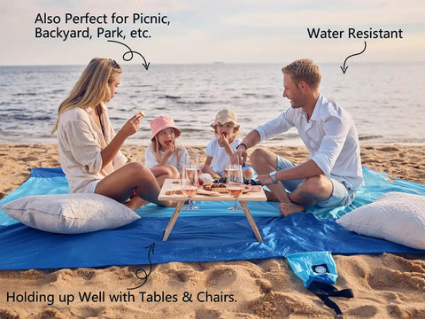 Family enjoying picnic on Sandproof Beach Blanket With 6 Stakes And 4 Corner Pockets Large 7 By 7 Feet 210 Cm Square Quick Dry Lightweight