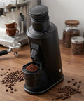 Top Shelf 80Mm Flat Burr Espresso Coffee Grinder In Matte Black With Heavy Duty Stainless Steel Burrs For Pour Over Drip French Press And Cold Brew Daily Driver Setup on wooden countertop.