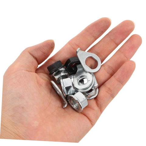 Beefed Up Heavy Duty Bicycle Wheel Axle Nut Kit With Carbon Steel Nuts And Anti Rotation Tab Washers For Mountain And Road Bikes Secure Retention Hardware To Prevent Loosening During Rough Rides. Hand holding carbon steel axle nuts and tab washers for bike hubs.