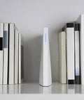 2 Smart Home Hub With Voice Control Works With Alexa And Google Assistant Lets You Control Cameras Doorbells Lighting Locks And Thermostats All From One Simple Easy To Use Center White between books on a shelf