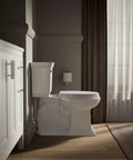 Heavy Duty Elongated White Toilet Seat Featuring Quick Release Hinges And Grip Tight Bumpers For Dead Simple Mounting And Super Fast Cleaning Upgrades Your Bathroom Setup Today in modern bathroom setting.