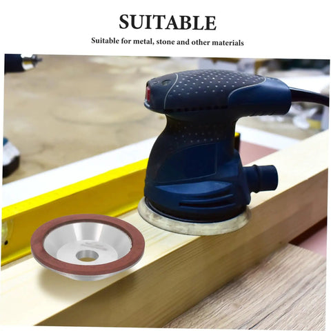 Heavy Duty Diamond Concave Cup Grinding Wheel Perfect For Precision Metal Carbide Cutting And Sharpening Angle Grinders with angle grinder on wood surface.
