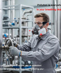 Worker wearing Pro Grade All In One Heavy Duty Respirator Mask With Filters And Safety Glasses, operating machinery in industrial setting.