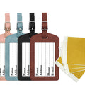 Four Pack No Fuss Needlepoint Luggage Tags Featuring Slick Faux Leather Shell And Crystal Clear Id Window in pink, blue, black, brown.