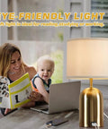 Woman and child with laptop beside Nightstand Table Lamp With Two USB Ports, 3-Way Dimmable Touch Control, Black Star Design, LED Bulb