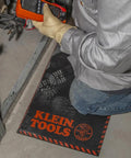 Technician kneeling on a Heavy Duty Kneeling Pad For Trades Pros With Handy Handle Large Soft Thick Closed Cell Foam Knee Cushion