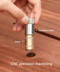 Hand holding stainless steel MFT table hole pin for quick locking in woodworking bench setup, showing precision and metal composition.
