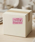 Hot Pink Fragile Stickers For Shipping Do Not Bend Do Not Crush Handle With Care Labels Pack Of 500 on a cardboard box