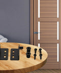 Pair Of Heavy Duty Iron Hinges With Bushings And Protective Plastic Caps on table ready for easy installation on wooden doors.