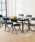 Folding Chairs Sets Of 10 330 Lb Capacity Plastic Stackable Portable Patio Dining Set For Indoor Outdoor Use Camping Garden Party Meeting Black Weather Resistant For Year Round Use arranged around a table indoors