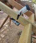 Steel Pneumatic Rafter Hook Hanger With One Quarter Inch Air Tool Swivel Fitting securing air nailer to wooden rafter