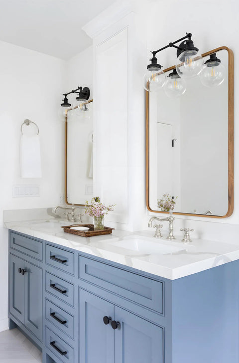 Bathroom with vintage industrial double wall sconce in black, dual 5.9 inch clear glass globe shades, mounted above mirror.