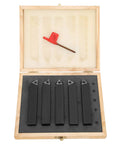 Five black carbide turning tool holders with replaceable tips in a wooden case, front view