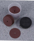 36 Piece Grinding Wheel And Cutting Disc Set for metalworking tools, showing red grinding wheels and black container on gray surface.