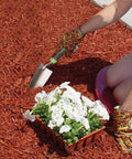 Person using Stainless Steel Hand Trowel With Ergo Gel Grip 13 Inch Cushioned Comfort Handle for planting in garden
