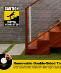 Watch Your Step Sign 12 By 9 Inch Double Sided Caution Sign Two Pack With Durable H Metal Stakes And Eight Double Sided Tapes installed on stairs