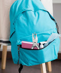 Quarter Inch Handy Hole Punch For Craft Paper And Tags in school bag with books and sanitizer