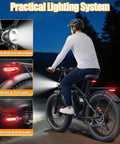 Rider on Beast 9000W Peak Dual Motor Ebike For Adults With 24 Inch Fat Tires Blue Finish Insane Torque Off Road Ready Tops Out At 47 MPH Electric Bike Built For Hills Trails And Urban Rides with lighting system