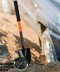 Extra Long 43.7 Inch Spade Shovel With Heavy Duty Steel Handle for Digging Gardening Camping Yard Work and Car Shovel Orange next to a car
