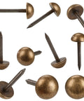 Top Shelf Solid Brass Antique Upholstery Tacks With Realistic Bronze Hue Heavy Duty Furniture And Carpet Thumb Tacks Straight Up Bang For Your Buck Wall Fastener Kit Size Half Inch, close-up of various tacks.