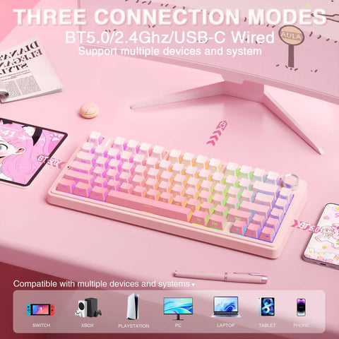 Dead Quiet Pink 75 Percent Wireless Mechanical Keyboard With Hot Swap Slots And Turn Dial, Bt50 And 24Ghz Wireless Setup, Pre Lubed Silent Switches With Rgb Backlight And Smooth Side Printed Pbt Keycaps For Your Killer Gaming Setup on a pink desk with devices.