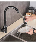 GAZOGJ Black Kitchen Faucet Pull Down Sink Mixer Tap 360°Rotation in use, washing a plate with a durable chrome finish.