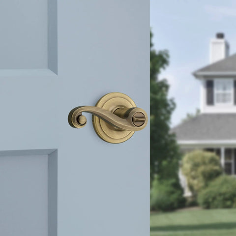 Lido Entry Door Lever With SmartKey Re-Key Security, Antique Brass Finish, Reversible for Left or Right Handed Doors on blue door