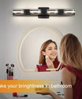 Modern LED Vanity Light 3-Head Wall Sconce for Bathroom, 19 Inch Black Finish, illuminating a woman at a mirror.