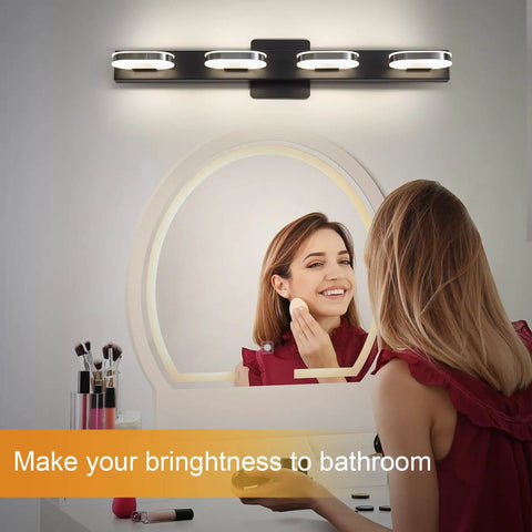 Modern LED Vanity Light 3-Head Wall Sconce for Bathroom, 19 Inch Black Finish, illuminating a woman at a mirror.