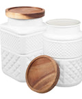 Premium Glass Storage Canisters With Wooden Lids 1800 ML Two Piece Set Airtight Sealed Jars for coffee tea sugar displayed on a countertop.