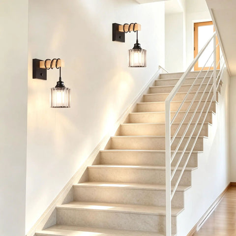BANGANMA 2-Pack Black Farmhouse Hardwired Wall Sconces Crystal for Bathroom on white wall beside stairs.