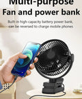8 Inch Magnetic Clip On Fan For Golf Cart With 12000mAh Battery shown on a table charging a mobile phone, demonstrating power bank feature.