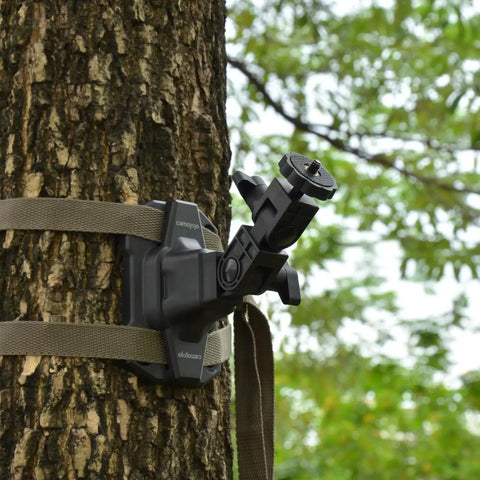 Trail Camera Mounting Bracket With 1/4-20 Threaded Insert 360 Degree Rotating Adjustable Holder attached to a tree with straps.