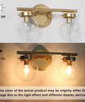 Two-Light Gold Vanity Light With Clear Globe Glass Shades Over-Mirror Fixture In Hand-Painted Gold Finish, off and on view