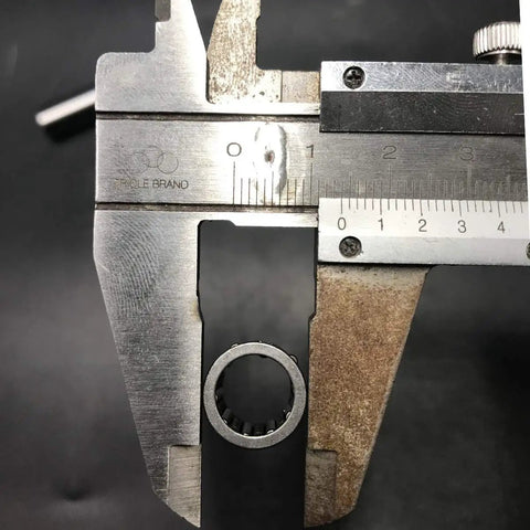 Measuring 80cc Needle Bearing from Two Stroke 66cc and 80cc Gas Powered Motorized Bicycle Replacement Kit with calipers.