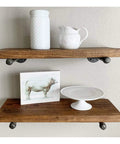 6 Pack 10 Inch Wall Mounted Industrial Pipe Clothing Rack Set supports wooden shelves with decorative items on display